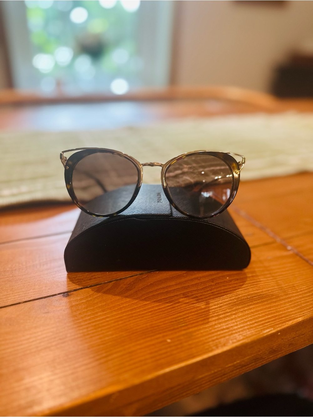 Prada Round Cat-Eye Sunglasses in Tortoiseshell and Gold